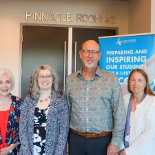 Group photo of 4 female retirees, one male retiree